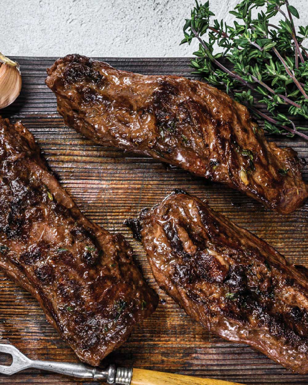 Prime NY Strip served with a petite herb salad and chimmichurri is a guest  favorite on our Butcher Corner selection! Pairs great with any