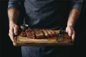 cut meat on a cutting board